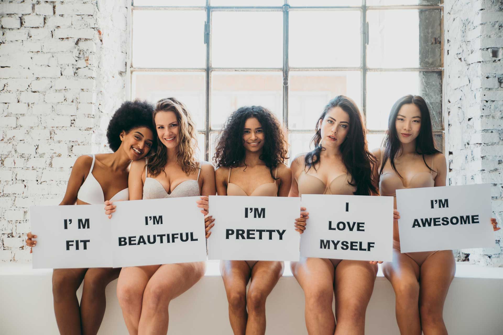 Empowered women sharing positive affirmations together.
