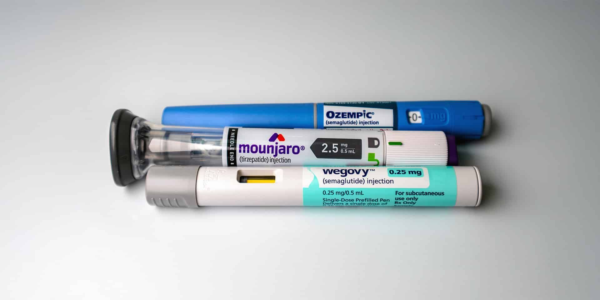 Diabetes medication injection pens on a white background.